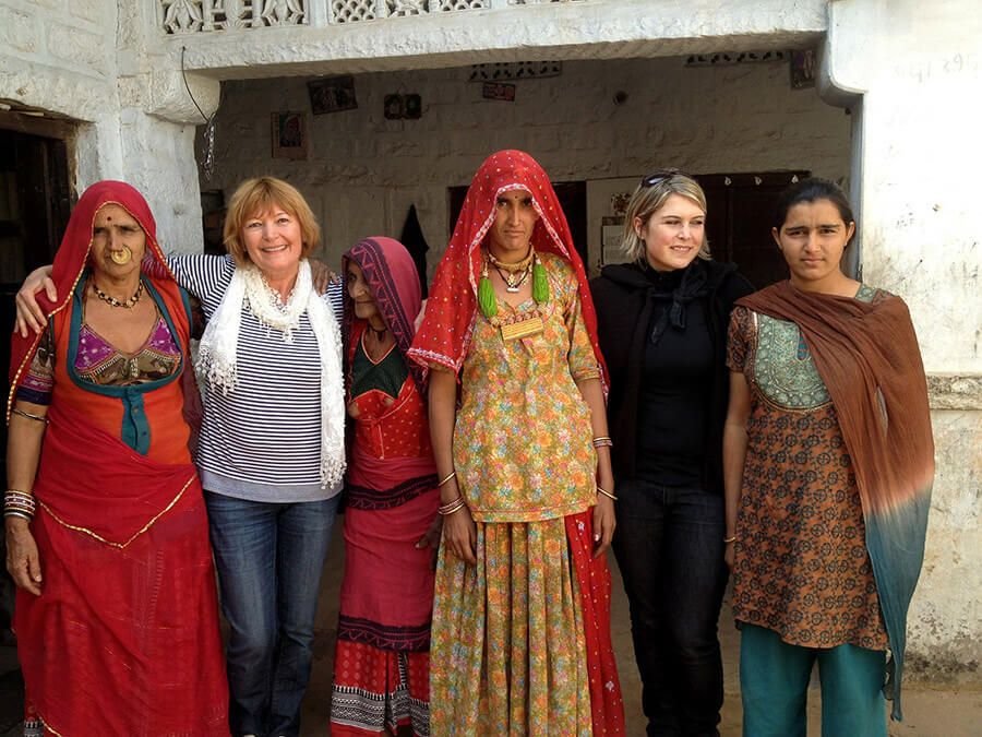 Guests with village women Visitors with village women outside a Bishnoi home, Jodhpur