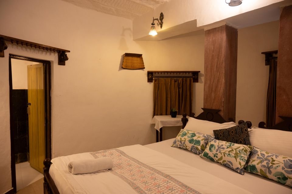 Comfortable double bed with block-print linen Garden Room double bed with block-print cushions at The Mandore, Jodhpur