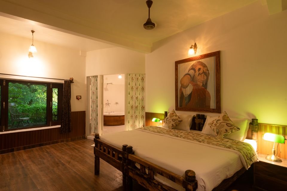 Garden window beside the bed Mandore Jacuzzi bedroom with garden window and view to the bathroom, Jodhpur