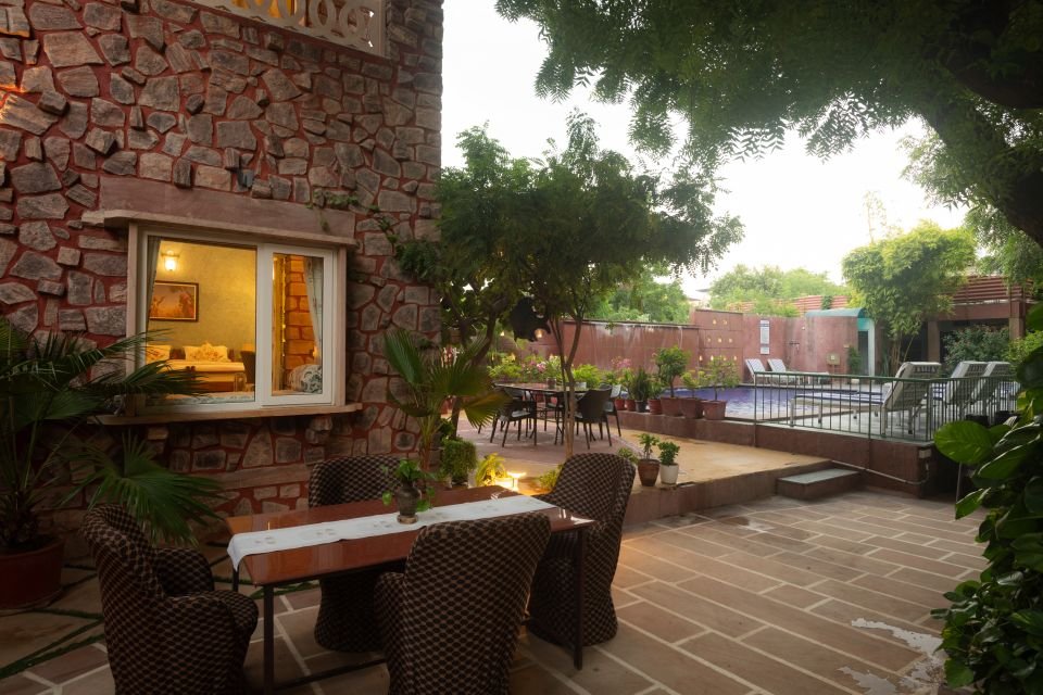 Courtyard seating by the pool Courtyard seating near the swimming pool outside the Mandore Premium rooms, Jodhpur