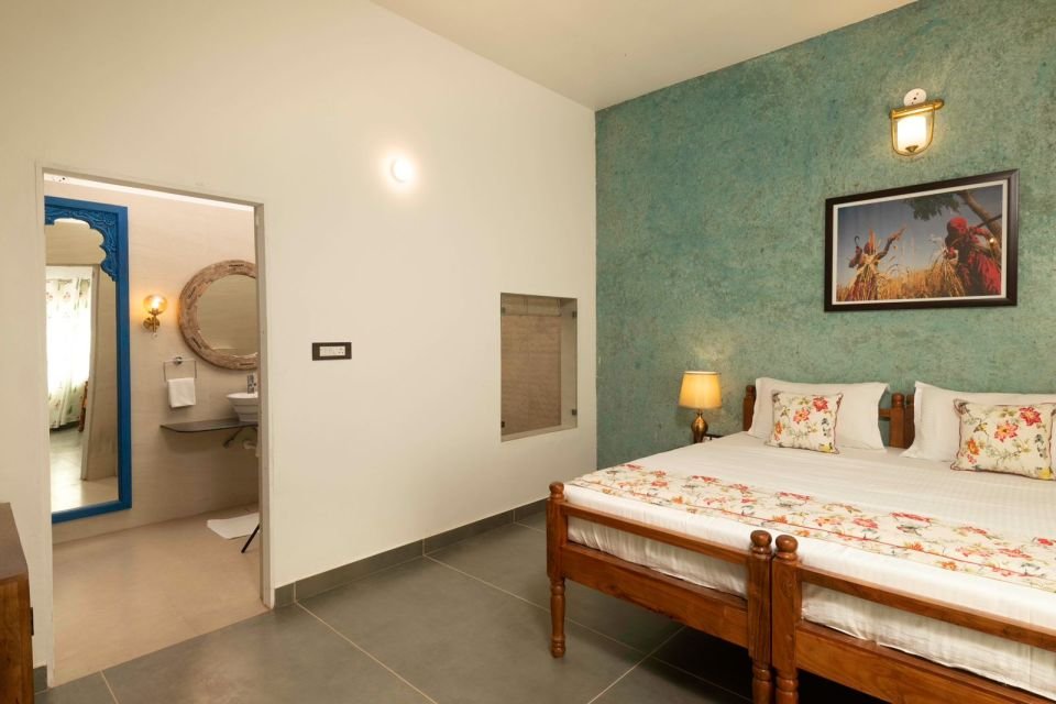 Twin-bed layout Mandore Premium room with twin beds and textured green wall at The Mandore, Jodhpur