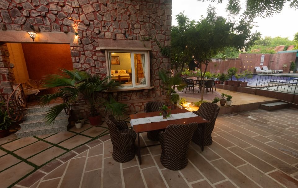 Courtyard seating overlooking the pool Courtyard seating overlooking the pool near the Mandore Suite, Jodhpur